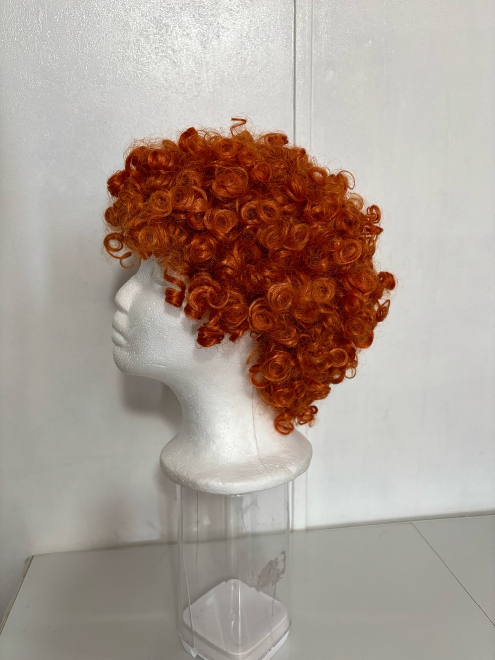 Short Orange-Red Curly Synthetic Wig One Size Unisex NEW.